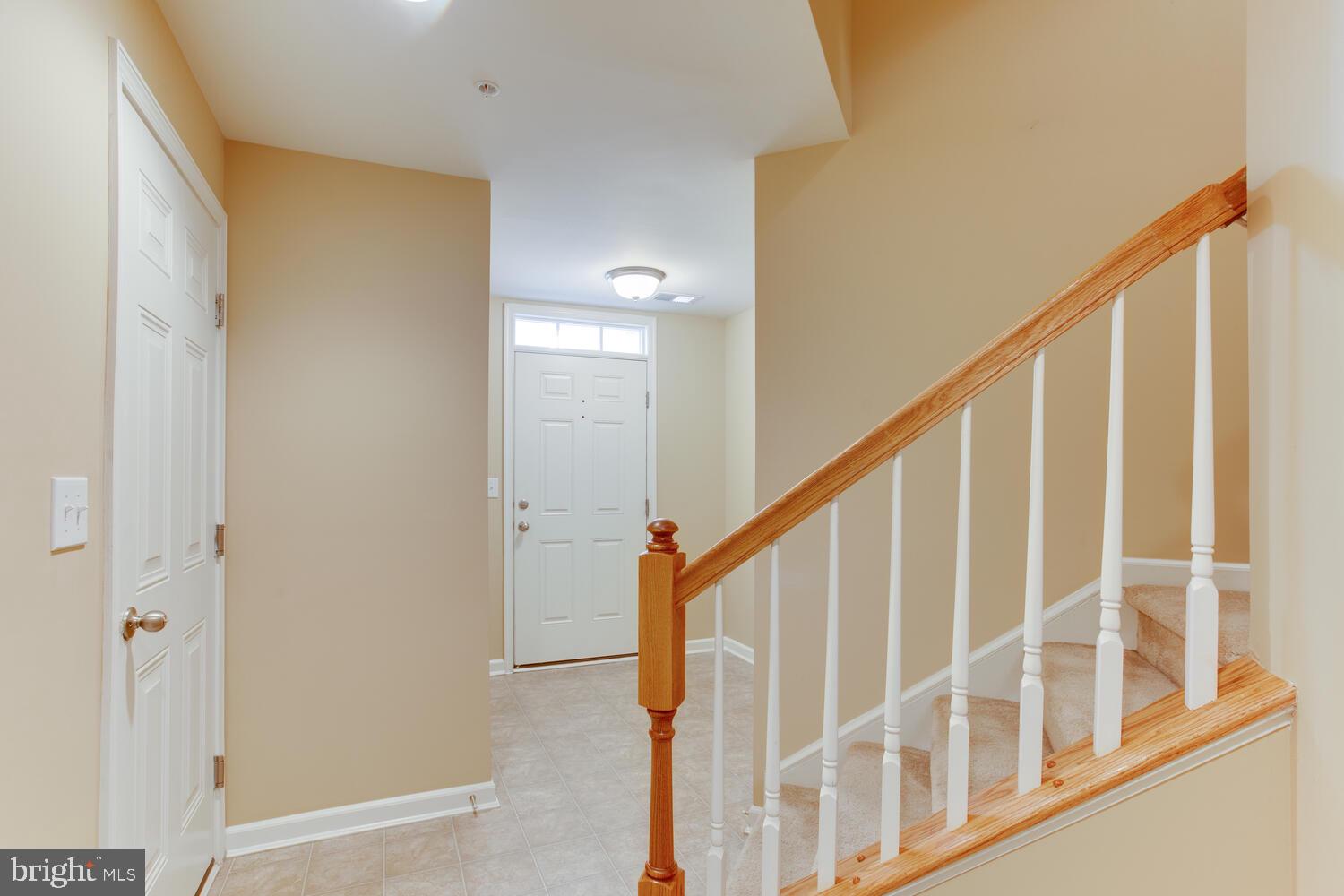 2303 Forest Ridge Terrace, Unit E Chesapeake Beach, MD 20732 - Photo 7 of 73 Enter from the garage to the foyer