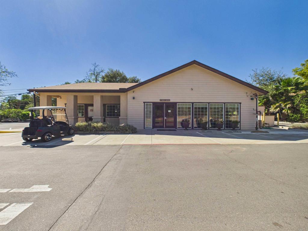 18218 Paradise Mountain Road, Unit 220 Valley Center, CA 92082 - Photo 19 of 48 front view of a house with a patio