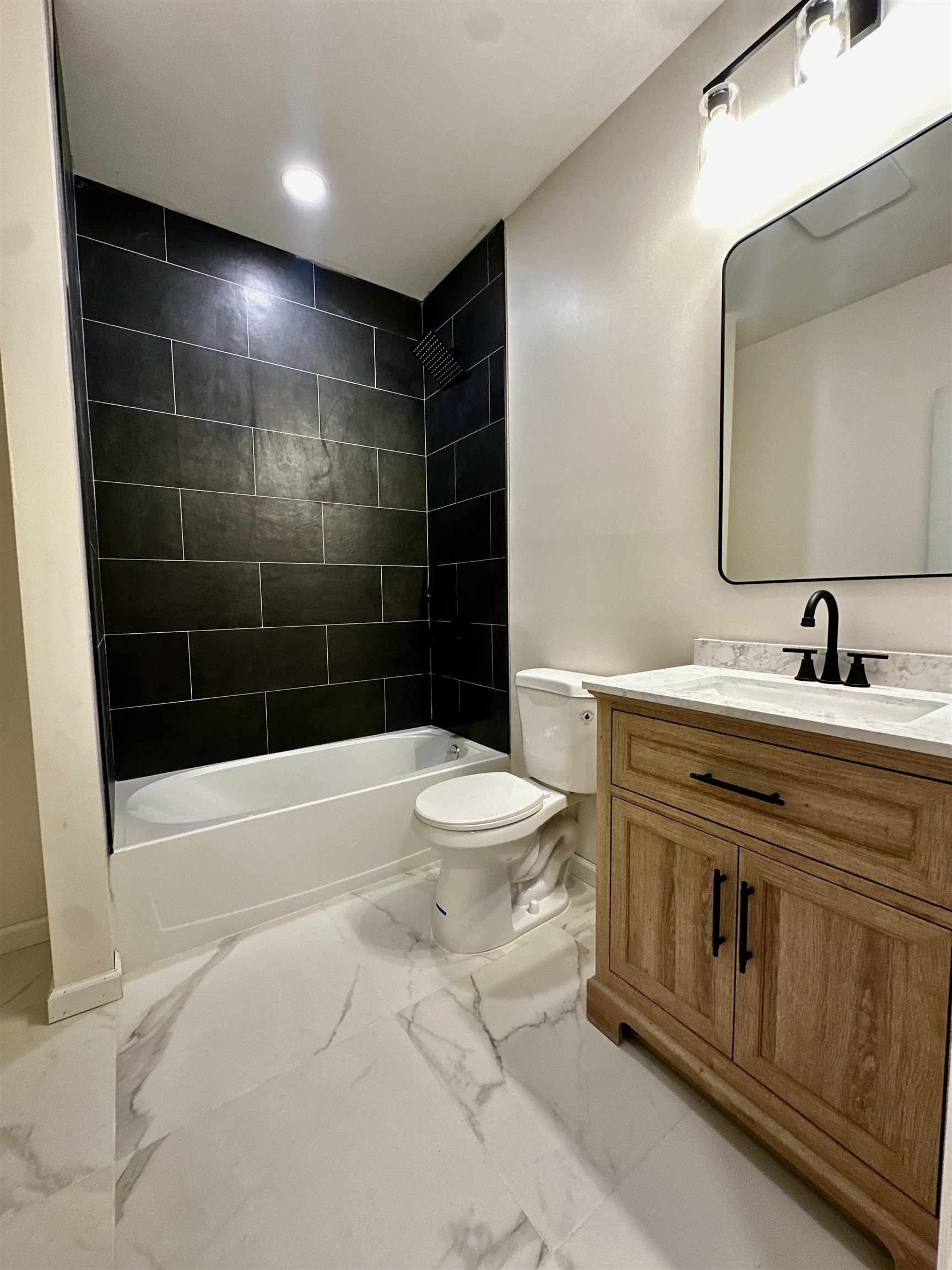 188 Heckel Street, Unit 1 Belleville, NJ 07109 - Photo 8 of 13 a bathroom with a sink a toilet and shower