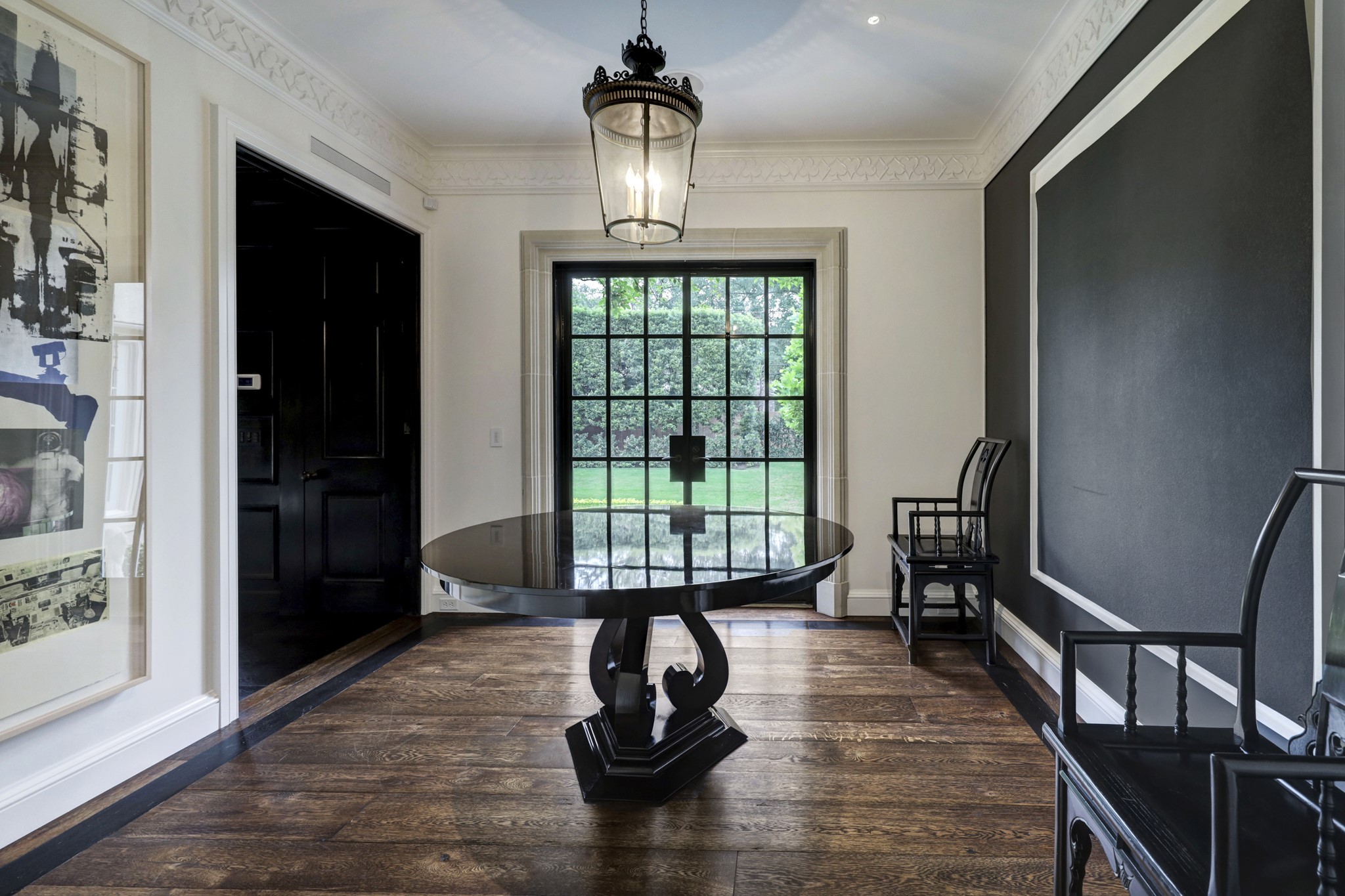 3 Briarwood Court Houston, TX 77019 - Photo 18 of 50 The Card Room with double metal doors to the backyard. Entry to the Library/Office to left of exterior doors. Custom millwork at crown molding.