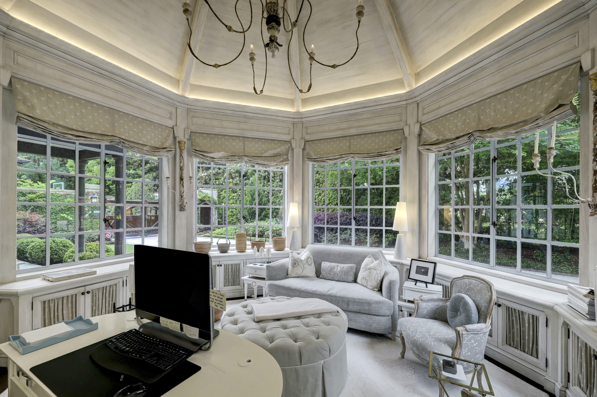 3 Briarwood Court Houston, TX 77019 - Photo 25 of 50 A cathedral ceiling in this office with great natural light. Custom Roman shades on windows above cabinet storage.