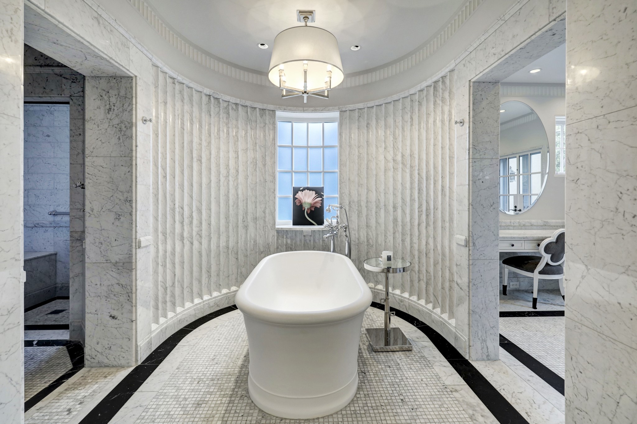 3 Briarwood Court Houston, TX 77019 - Photo 34 of 50 Carve fluted marble wall surrounds freestanding tub with cased opening to vanity area.