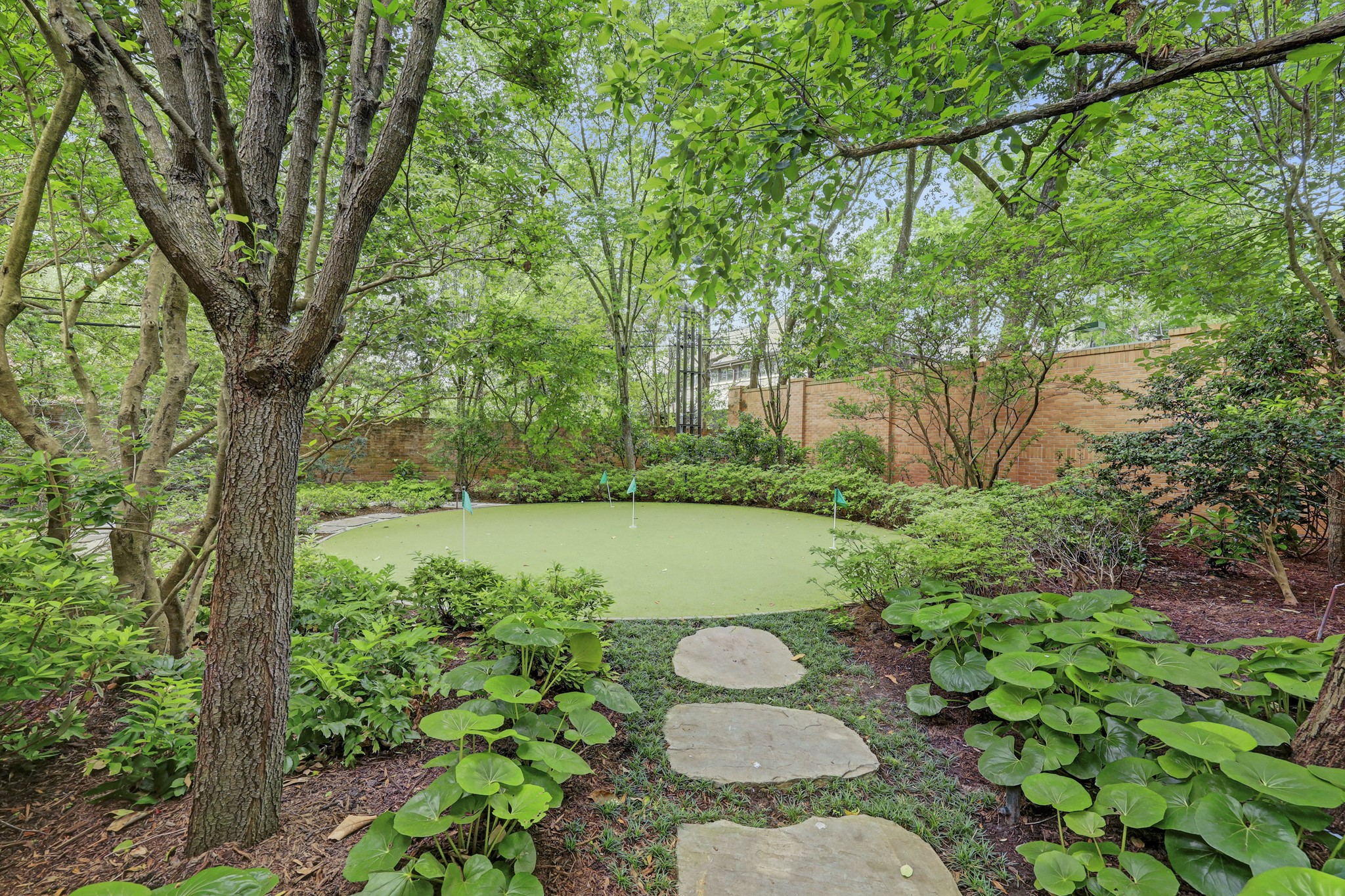 3 Briarwood Court Houston, TX 77019 - Photo 48 of 50 The Putting Green and secret garden is accessed from backyard.