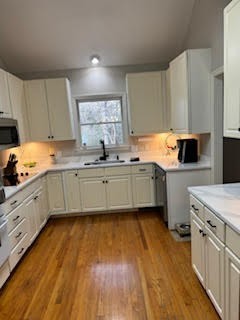 5544 South New Hope Road Hermitage, TN 37076 - Photo 52 of 62 a kitchen with stainless steel appliances a sink cabinets and wooden floor