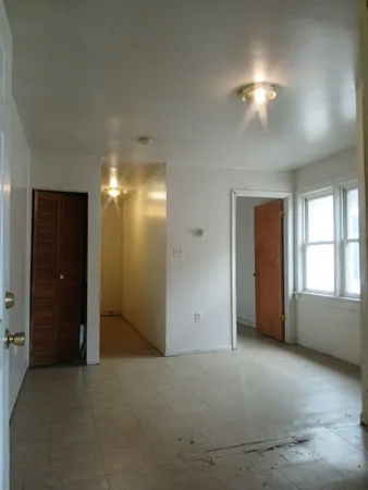 a kitchen with a cabinets and white appliances