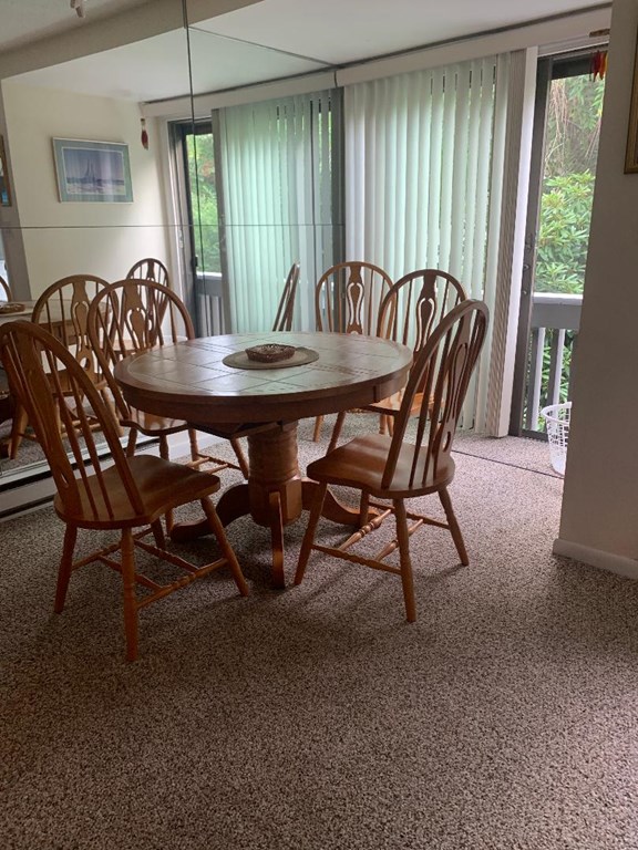 18 Atlantic Road, Unit 41 Gloucester, MA 01930 - Photo 8 of 17 a view of a dining room with furniture window and outside view