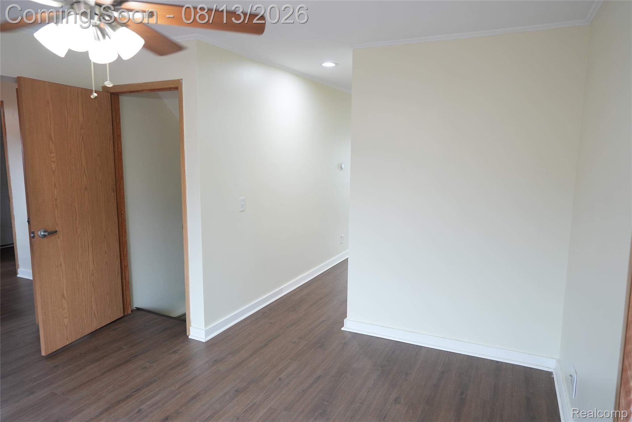 2018 John R Road Troy, MI 48083 - Photo 29 of 57 Wood-finish flooring with white trim and a ceiling fan light fixture