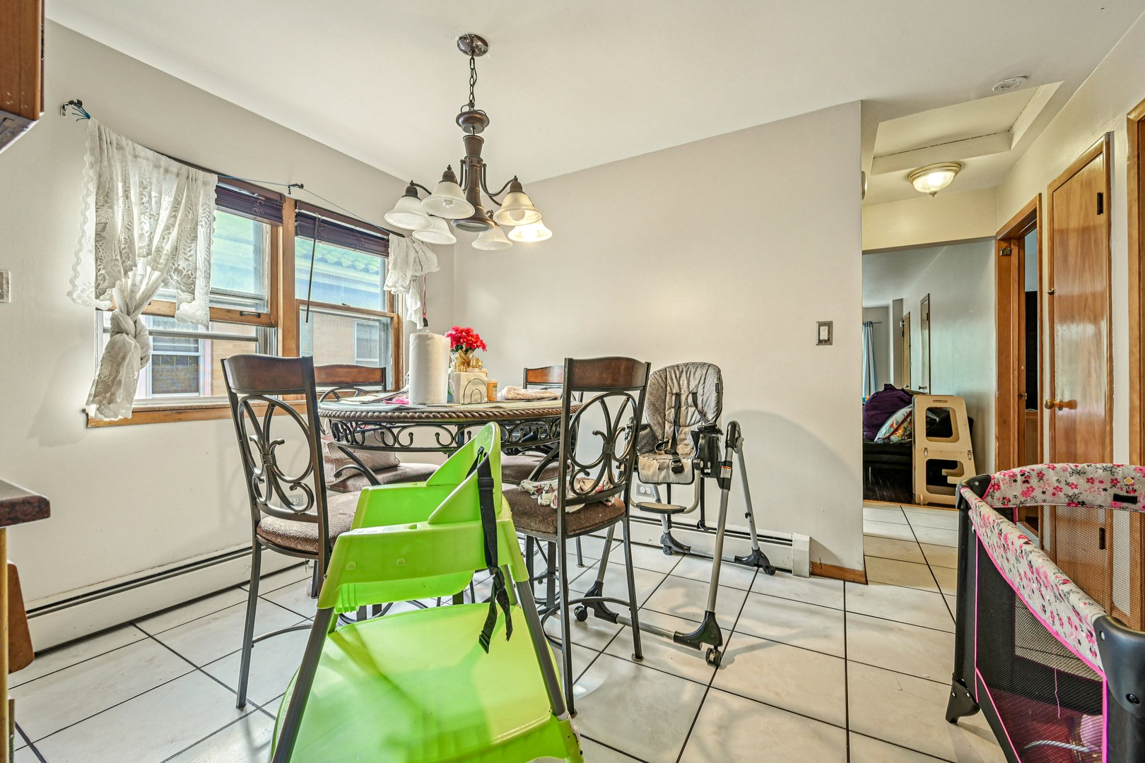 1841 South 61st Court Cicero, IL 60804 - Photo 11 of 46 a view of a dining room with furniture and chandelier
