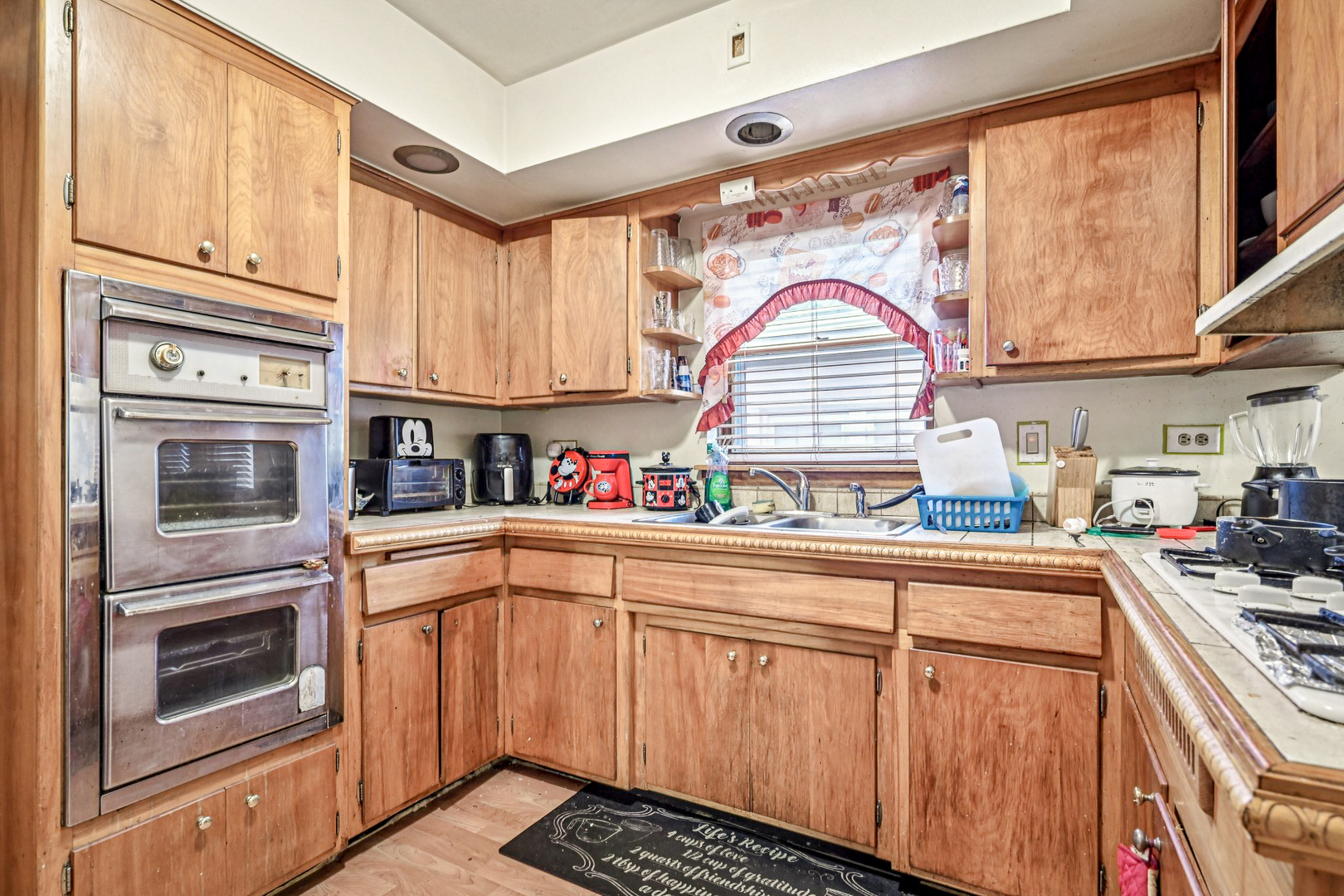 1841 South 61st Court Cicero, IL 60804 - Photo 14 of 46 a kitchen with stainless steel appliances granite countertop a sink and cabinets