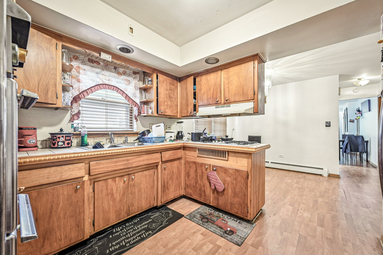 1841 South 61st Court Cicero, IL 60804 - Photo 15 of 46 a kitchen with stainless steel appliances granite countertop a stove a sink and a microwave