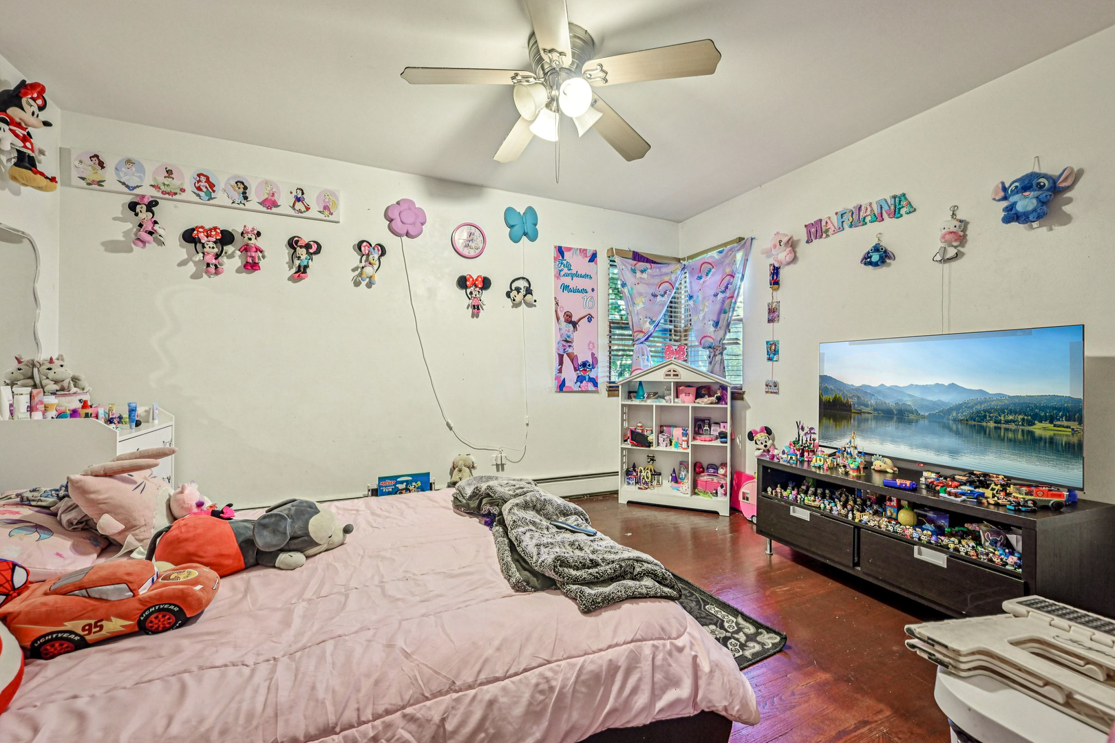 1841 South 61st Court Cicero, IL 60804 - Photo 31 of 46 a bedroom with bed and a flat tv screen on the dresser