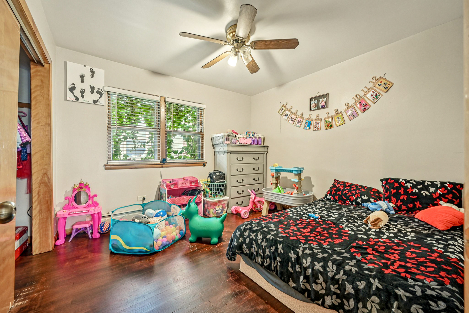 1841 South 61st Court Cicero, IL 60804 - Photo 34 of 46 a bedroom with furniture and a chandelier
