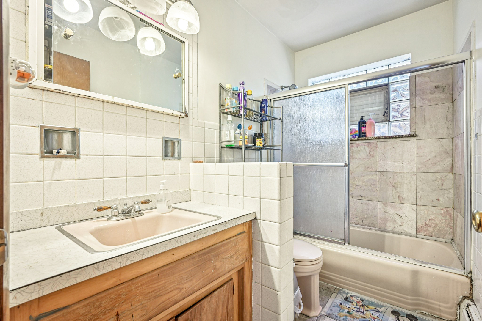 1841 South 61st Court Cicero, IL 60804 - Photo 36 of 46 a bathroom with a sink toilet and shower