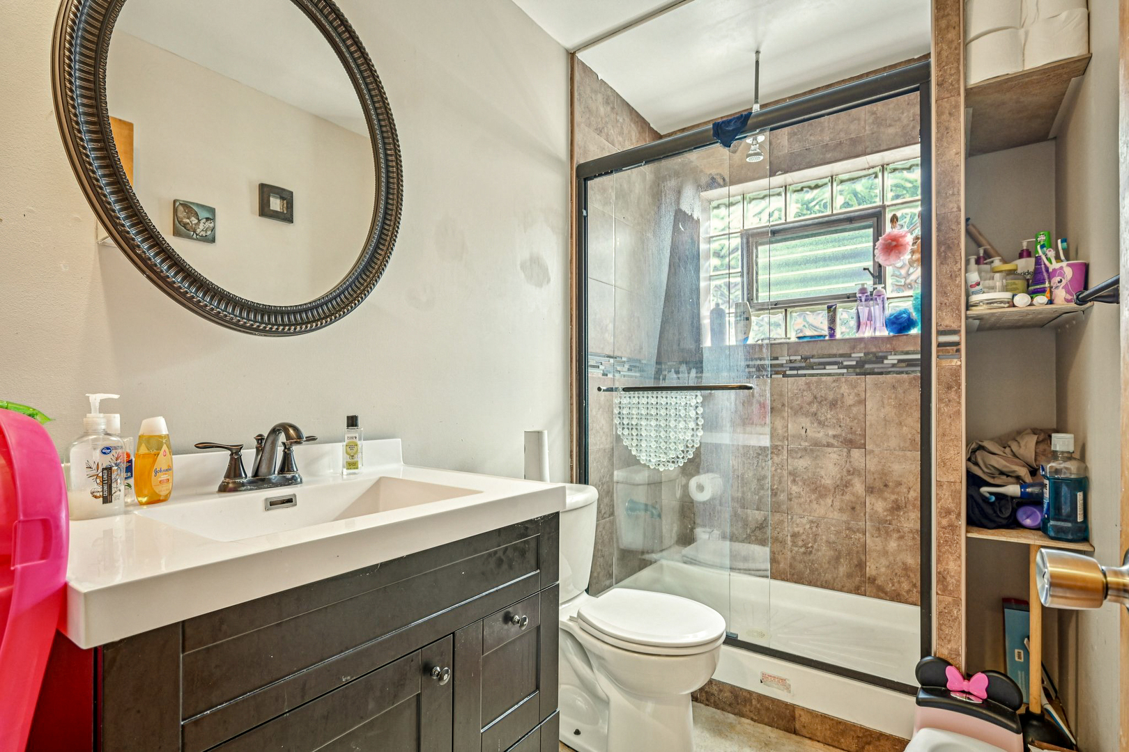 1841 South 61st Court Cicero, IL 60804 - Photo 37 of 46 a bathroom with a sink and a mirror
