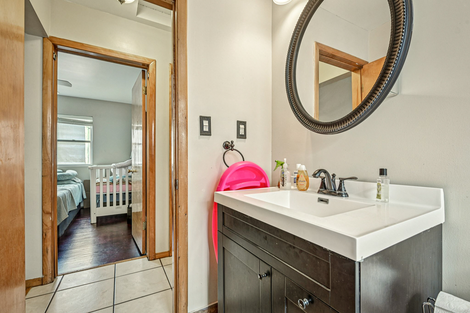 1841 South 61st Court Cicero, IL 60804 - Photo 38 of 46 a en suite bathroom with a sink and a mirror