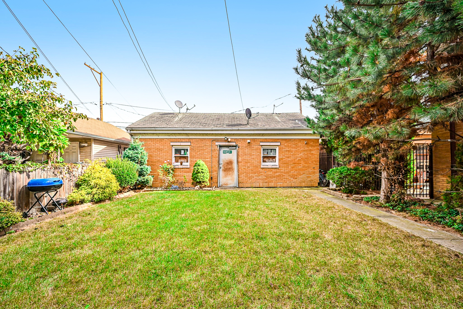 1841 South 61st Court Cicero, IL 60804 - Photo 41 of 46 a front view of a house with a yard