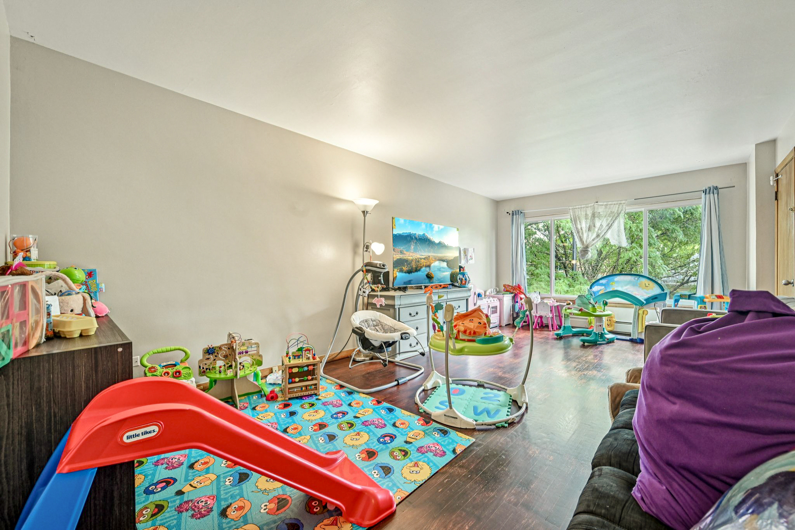 1841 South 61st Court Cicero, IL 60804 - Photo 9 of 46 a play room with furniture and a small window