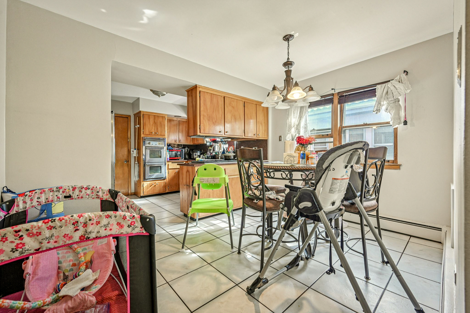 1841 South 61st Court Cicero, IL 60804 - Photo 10 of 46 a view of a dining room with furniture and window