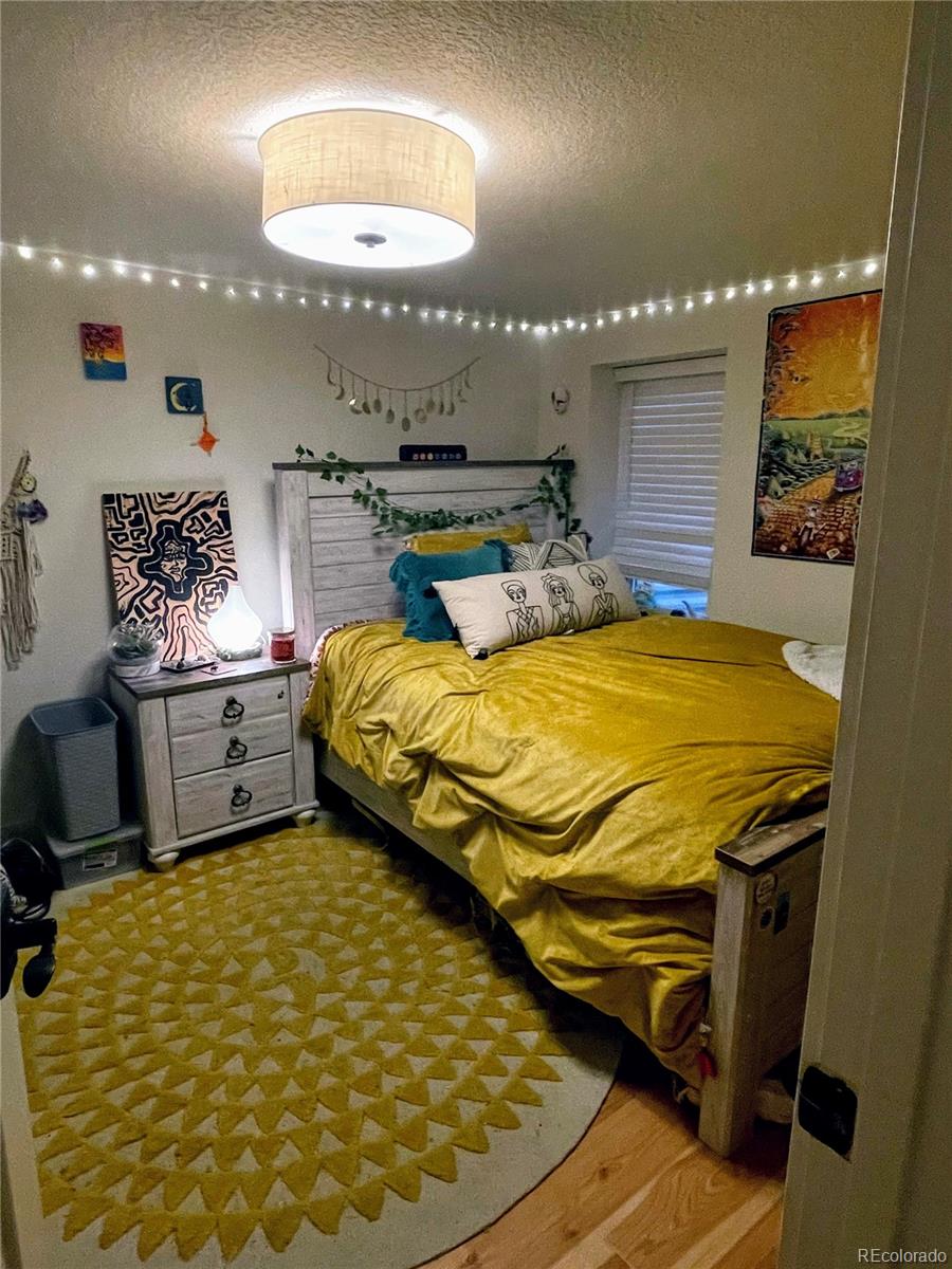 1069 11th Street Boulder, CO 80302 - Photo 12 of 28 a bedroom with a bed and a mirror