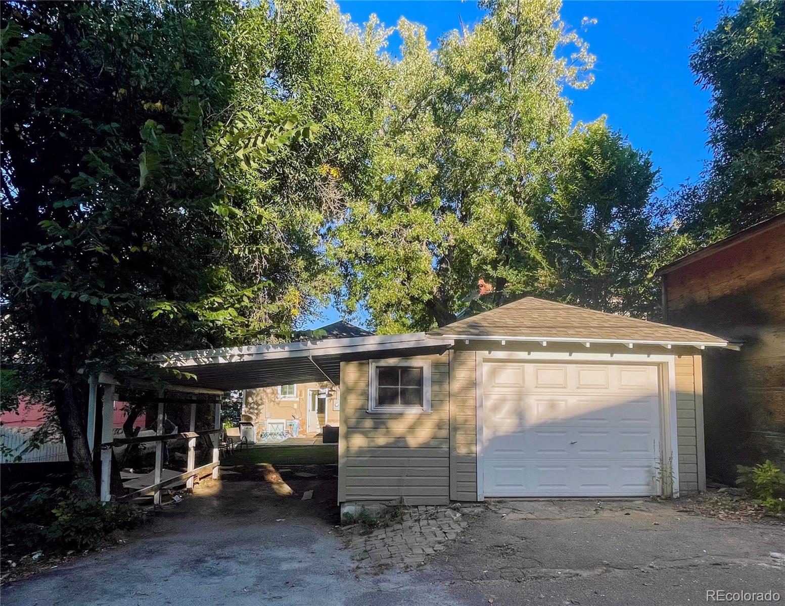 1069 11th Street Boulder, CO 80302 - Photo 20 of 28 a front view of a house with a yard