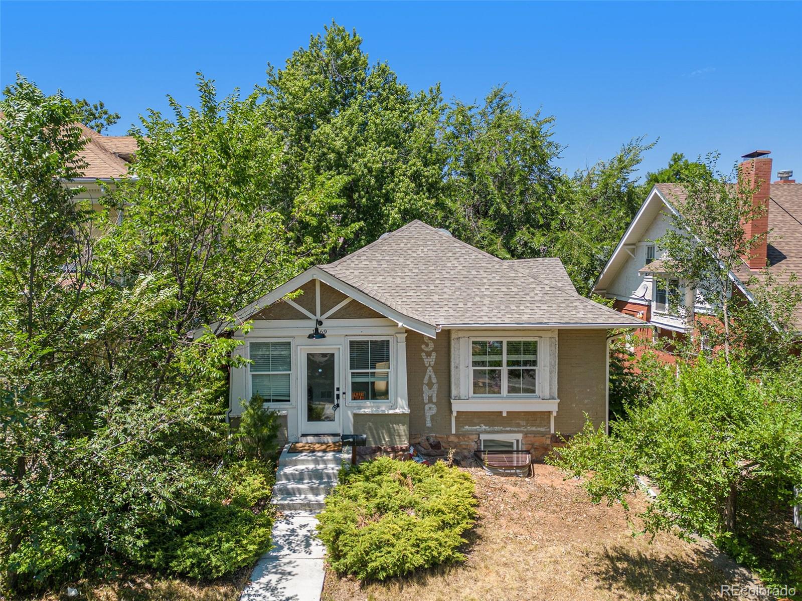 1069 11th Street Boulder, CO 80302 - Photo 25 of 28 a front view of a house with garden