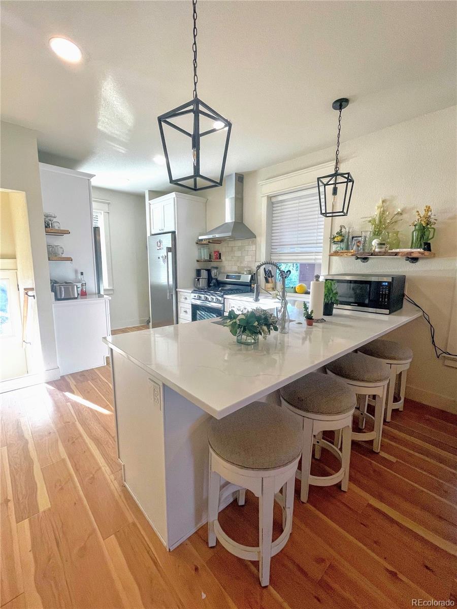 1069 11th Street Boulder, CO 80302 - Photo 3 of 28 a view of a dining room with furniture window and wooden floor