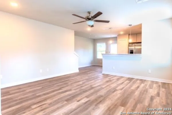 a kitchen with stainless steel appliances granite countertop a sink and stove top oven