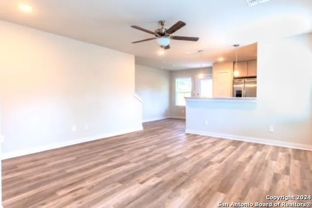 a kitchen with stainless steel appliances granite countertop a sink and stove top oven