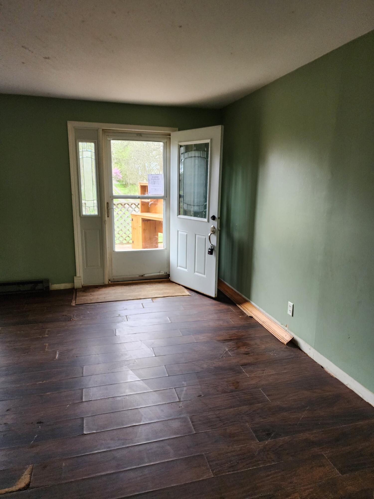 2965 Bunkum Road Rensselaer, IN 47978 - Photo 24 of 39 an empty room with wooden floor and windows