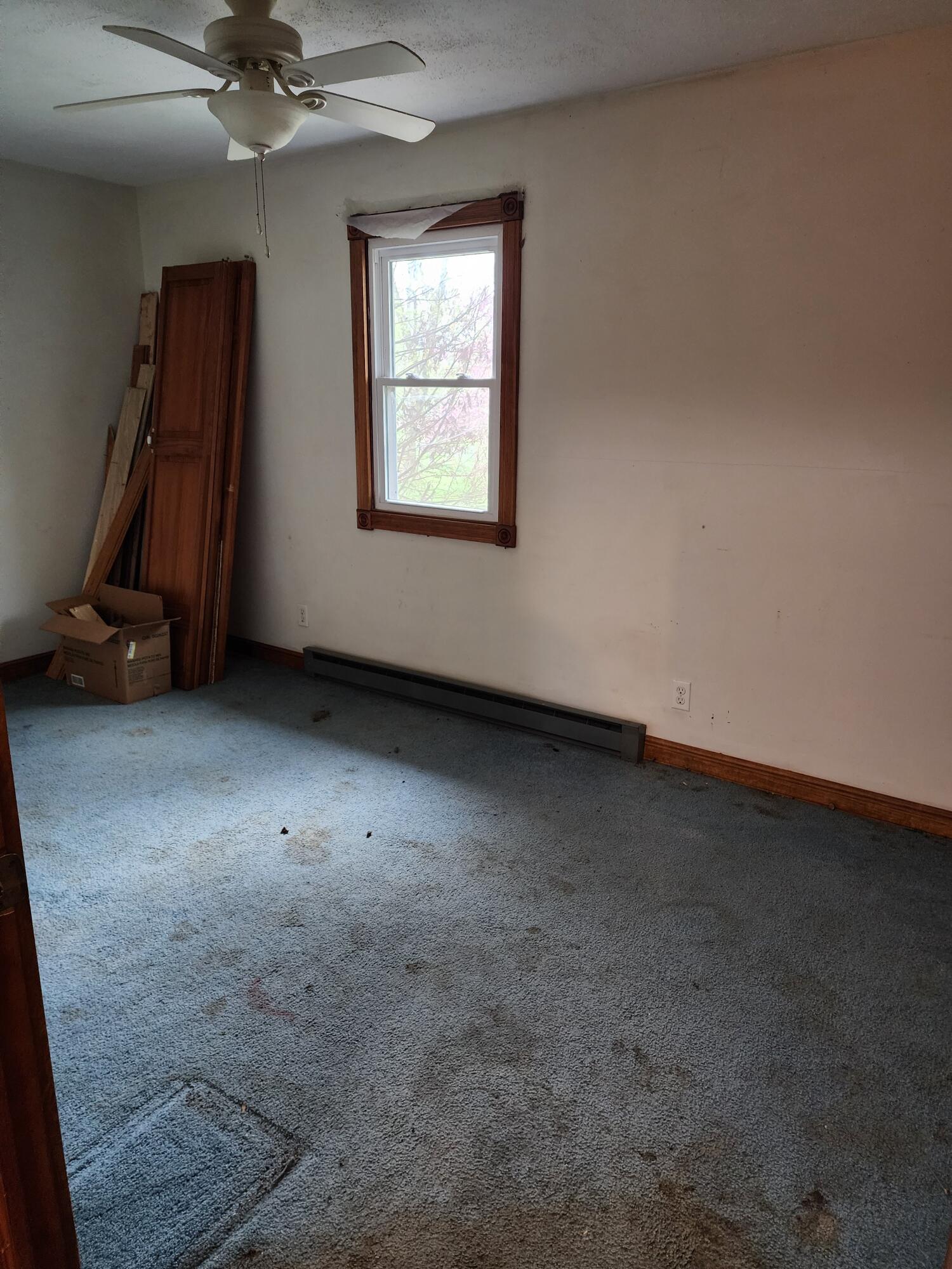 2965 Bunkum Road Rensselaer, IN 47978 - Photo 31 of 39 an empty room with a chandelier fan and windows