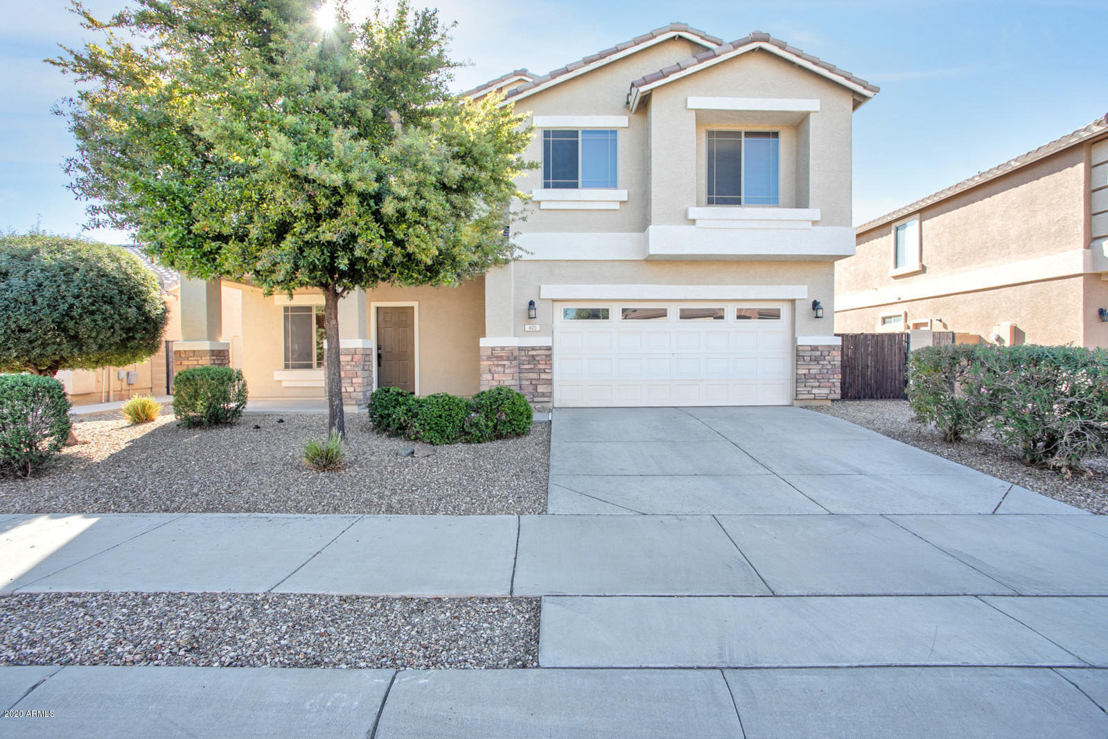 401 South 166th Drive Goodyear, AZ 85338 - Photo 1 of 33 a front view of a house with yard