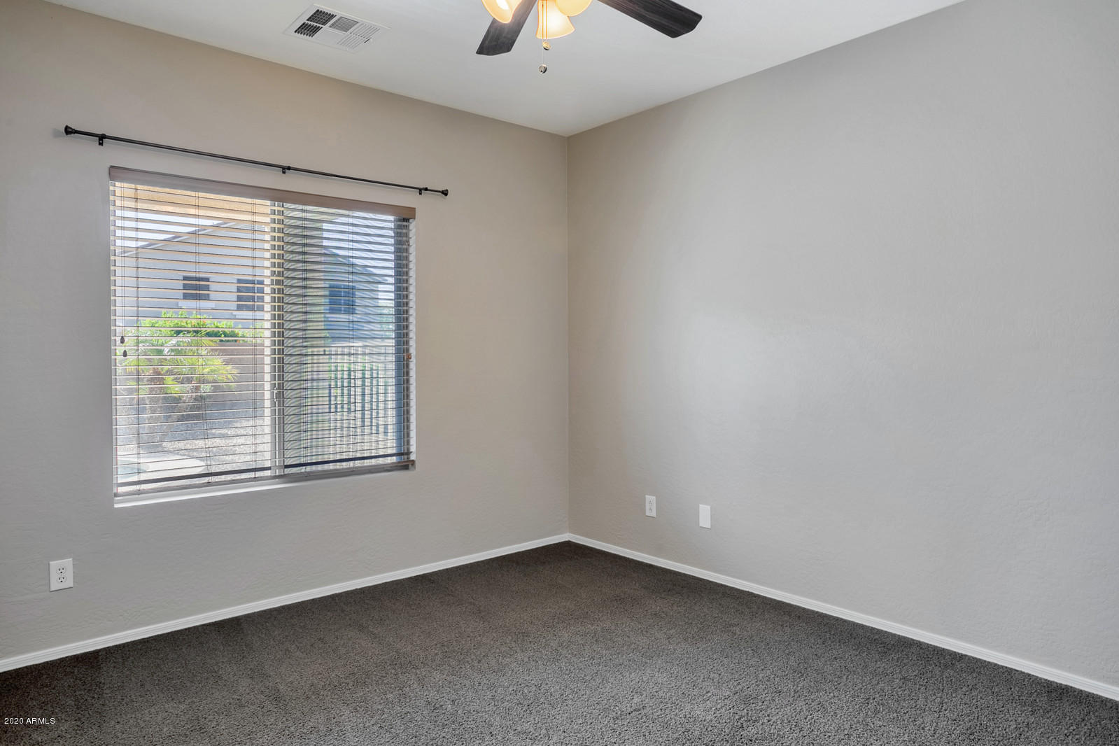 401 South 166th Drive Goodyear, AZ 85338 - Photo 12 of 33 an empty room with a window