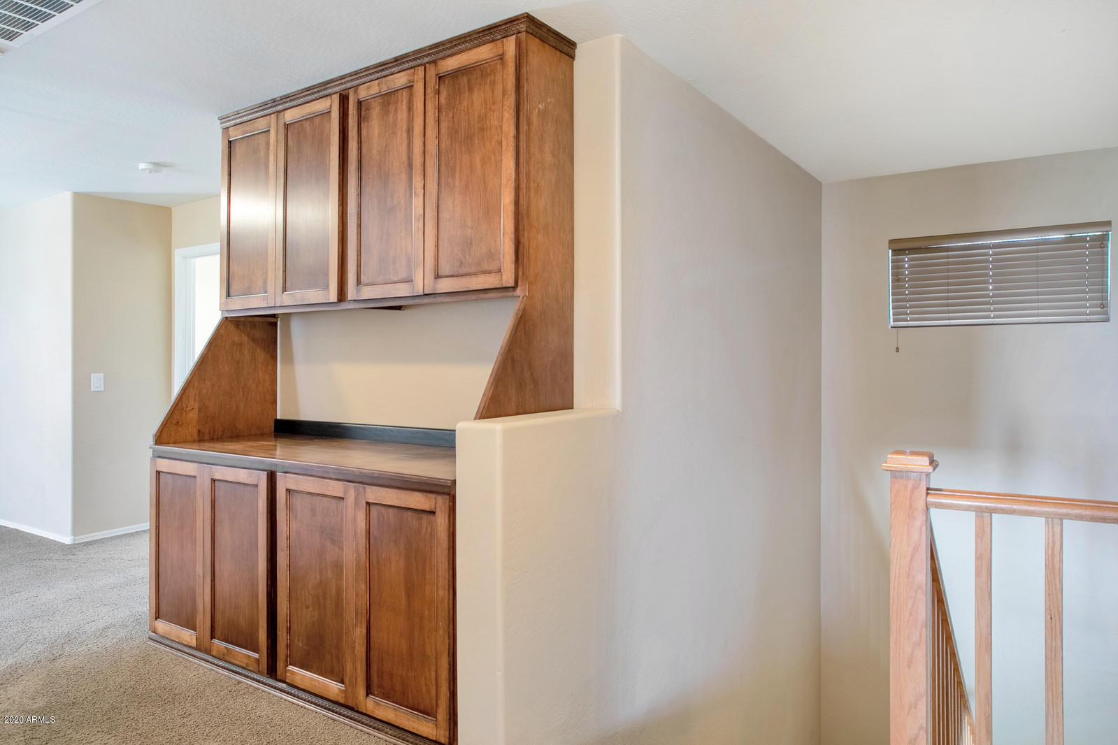 401 South 166th Drive Goodyear, AZ 85338 - Photo 15 of 33 a kitchen with cabinets and stainless steel appliances