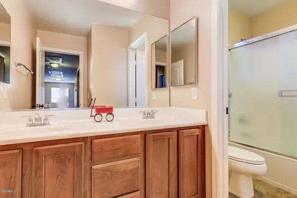 a bathroom with a shower and a toilet