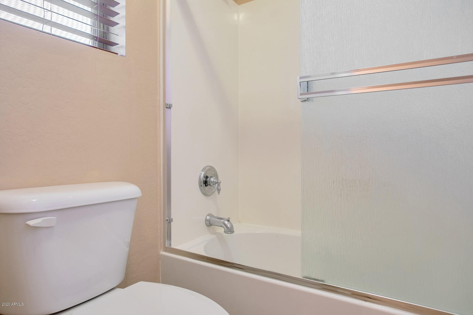 401 South 166th Drive Goodyear, AZ 85338 - Photo 25 of 33 a bathroom with a shower and a toilet