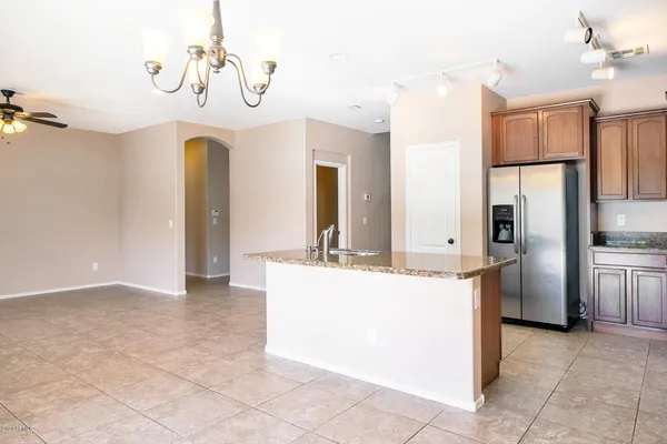 a kitchen with stainless steel appliances a stove a sink a microwave a counter top space and cabinets