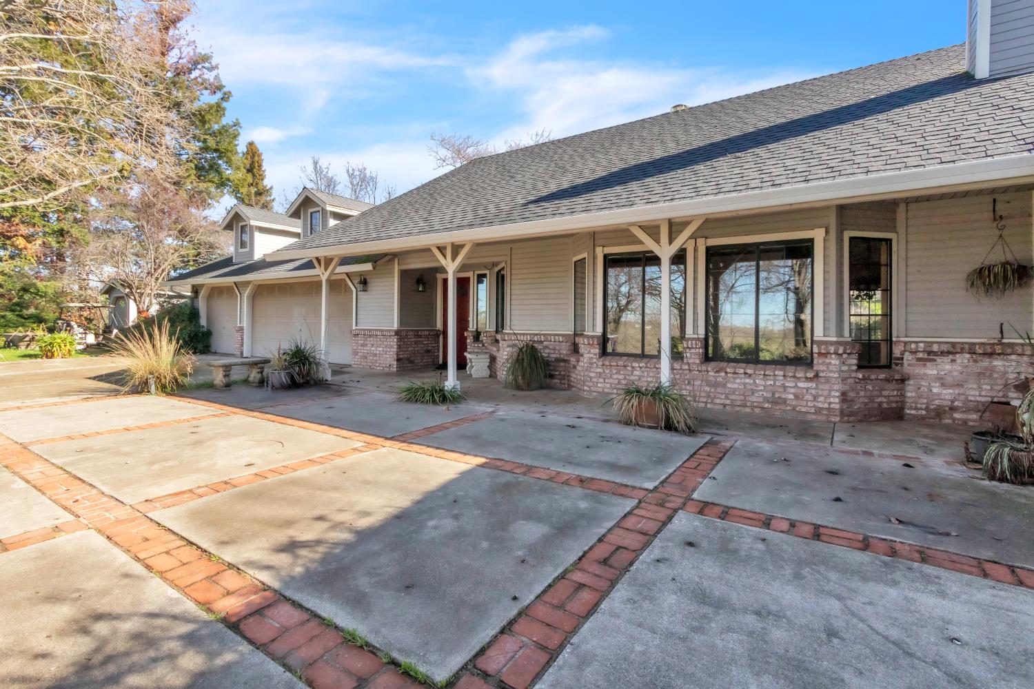 6330 Wise Road Auburn, CA 95603 - Photo 1 of 1 a front view of a house with yard and glass windows