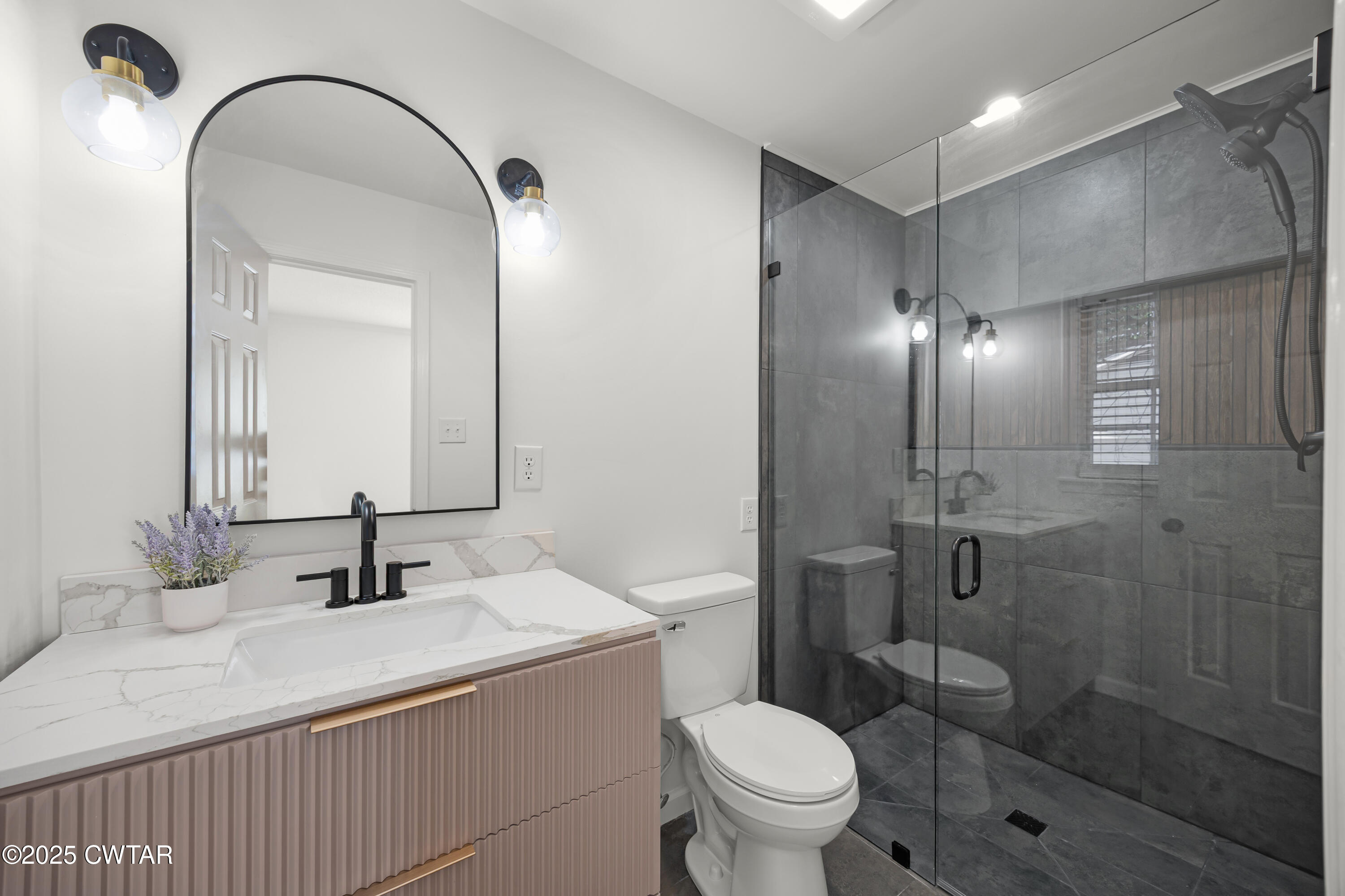 247 Highway 412 Jackson, TN 38305 - Photo 21 of 29 a bathroom with a sink and a mirror