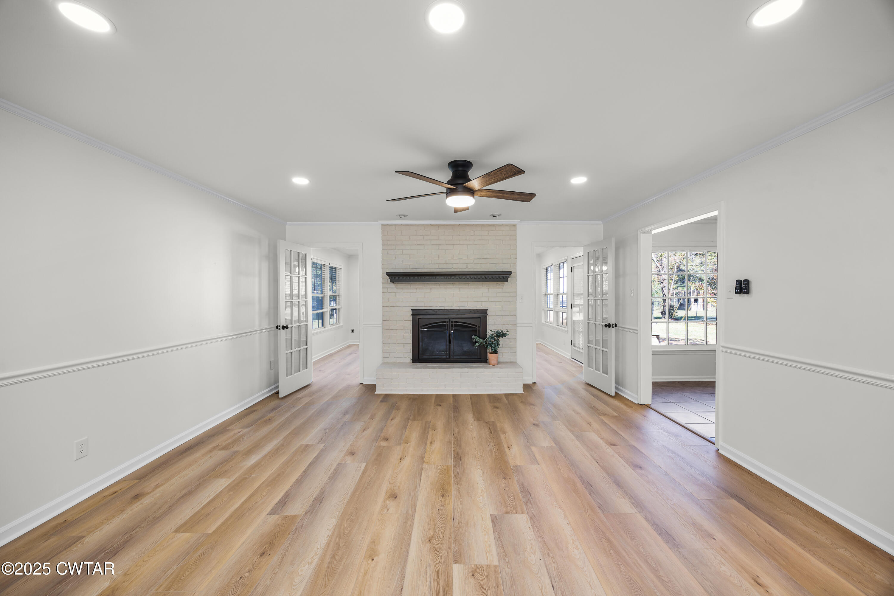 247 Highway 412 Jackson, TN 38305 - Photo 5 of 29 a view of an empty room with a fireplace and a window