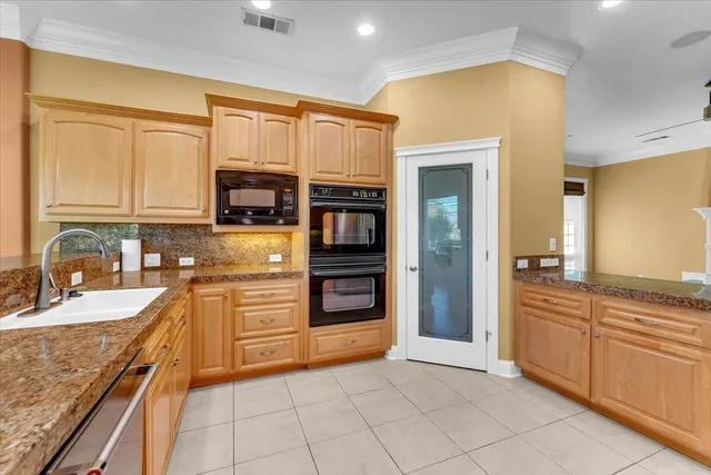 a view of a livingroom with a ceiling fan and window