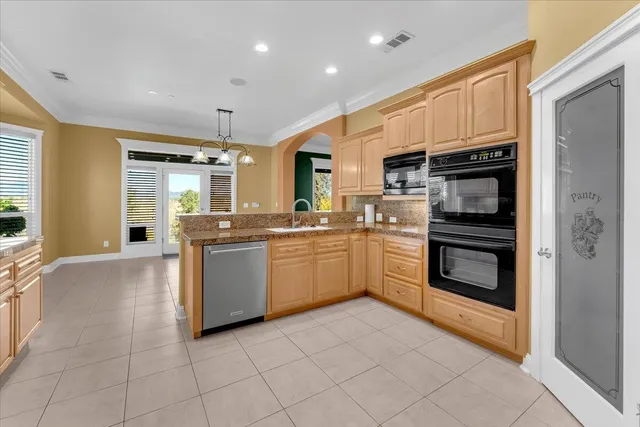 a spacious bathroom with a granite countertop sink a large mirror and a bathtub with shower