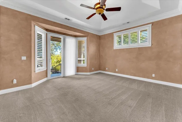 a view of an empty room with windows