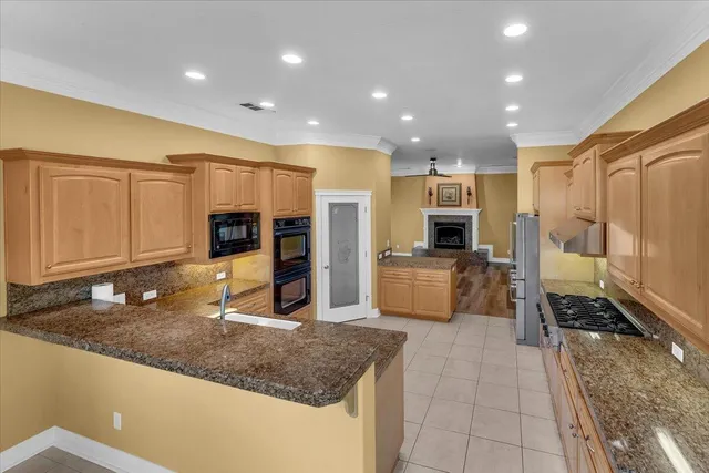 a view of a livingroom with a fireplace and wooden floor