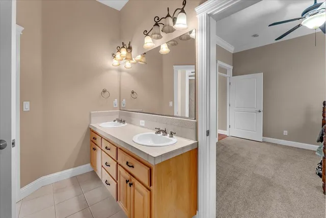 a front view of a house with a garden and yard