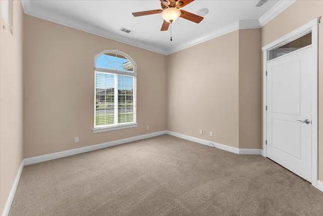 an aerial view of a house with a yard and garden