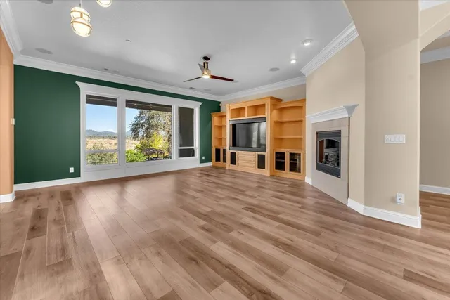a kitchen with granite countertop cabinets stainless steel appliances and a counter top space