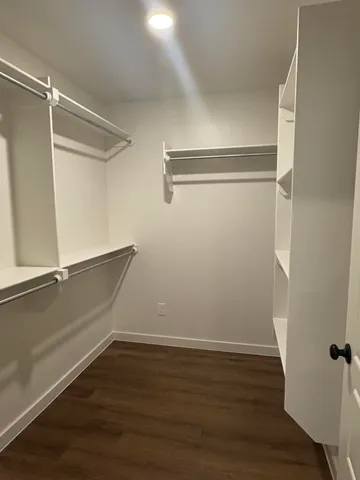 a view of an empty walk in closet