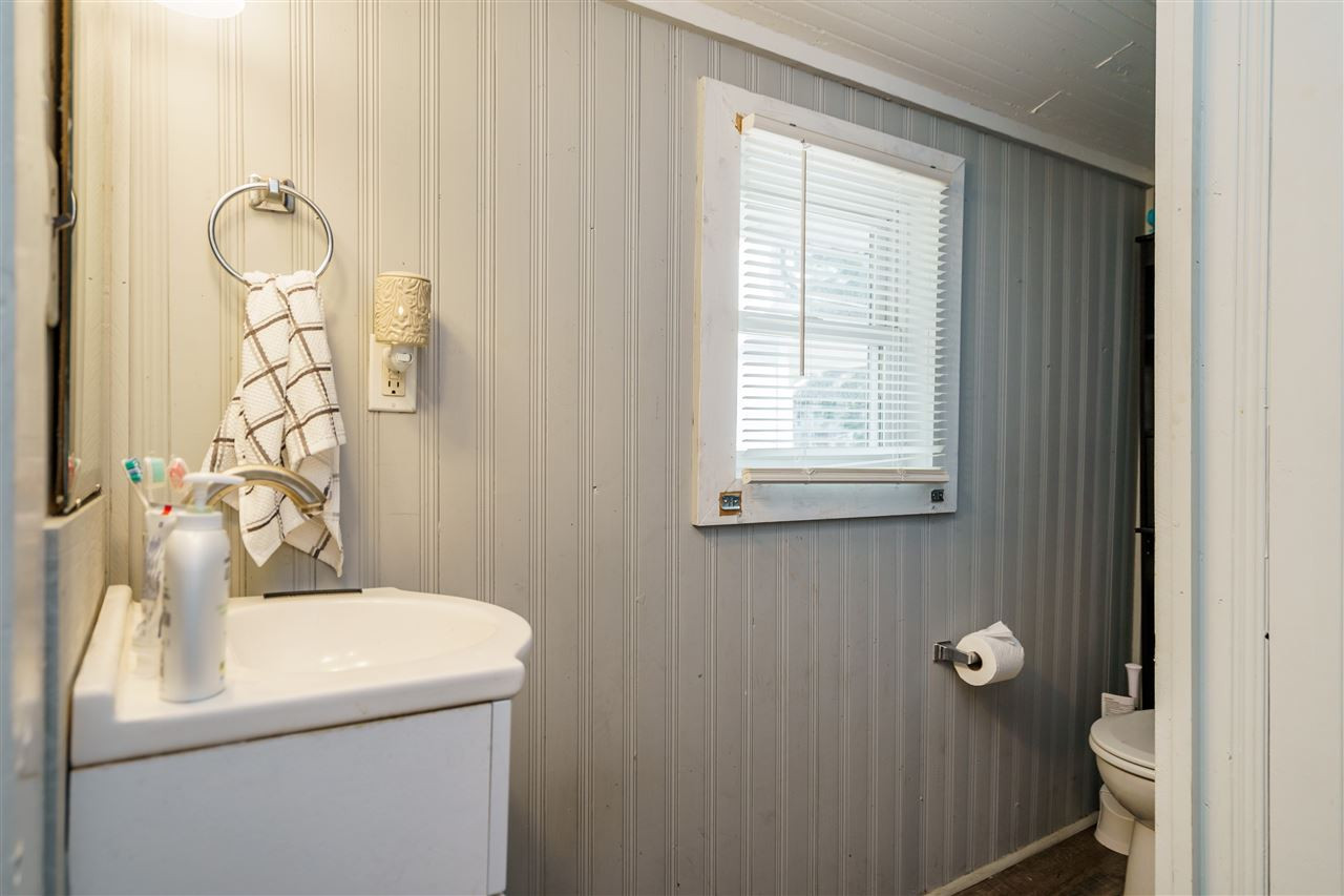 2402 Everett Avenue Raleigh, NC 27607 - Photo 18 of 20 a bathroom with a sink and a mirror