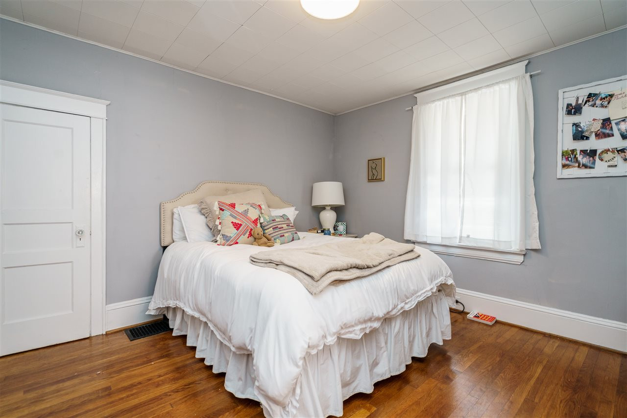 2402 Everett Avenue Raleigh, NC 27607 - Photo 9 of 20 a bedroom with bed and a window