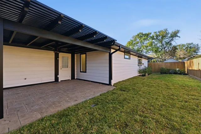a backyard of a house with lots of green space